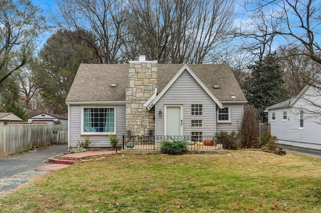 back of property featuring a yard