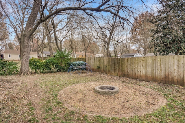 view of yard featuring a fire pit