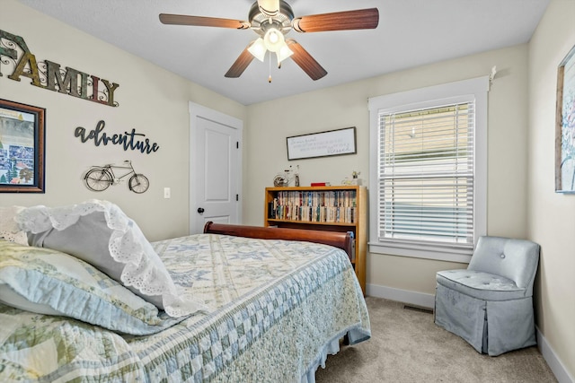 carpeted bedroom featuring ceiling fan