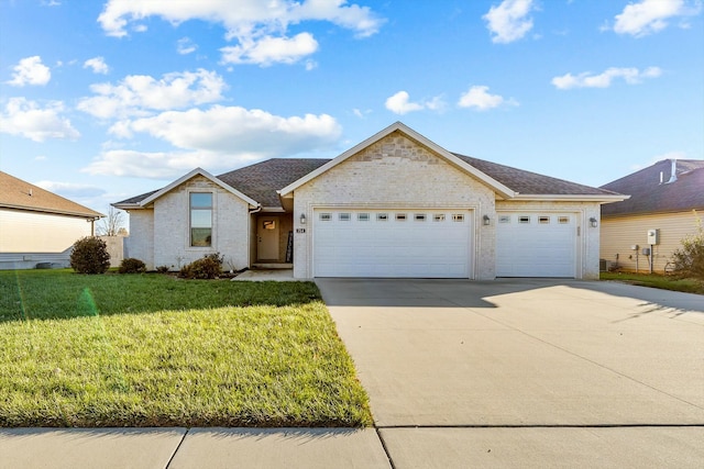 ranch-style home featuring a front lawn and a garage