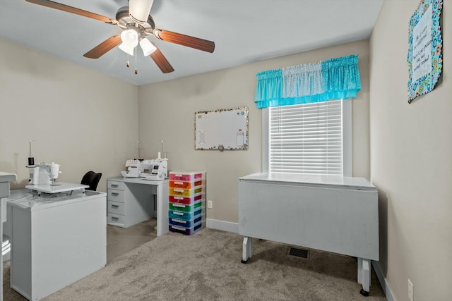 office with ceiling fan and light carpet