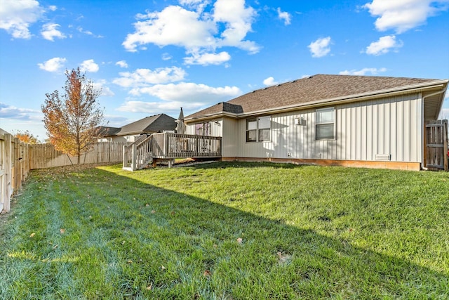 view of yard featuring a wooden deck