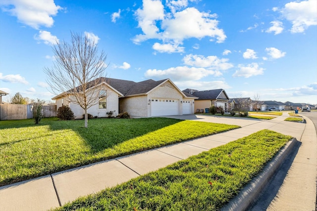 ranch-style home with a garage and a front yard