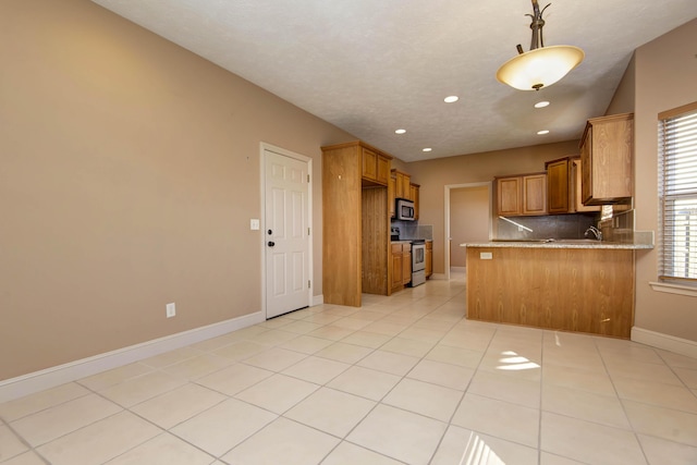 kitchen featuring kitchen peninsula, decorative backsplash, a kitchen breakfast bar, stainless steel appliances, and light tile patterned floors