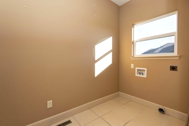 laundry area with light tile patterned flooring, washer hookup, and hookup for an electric dryer