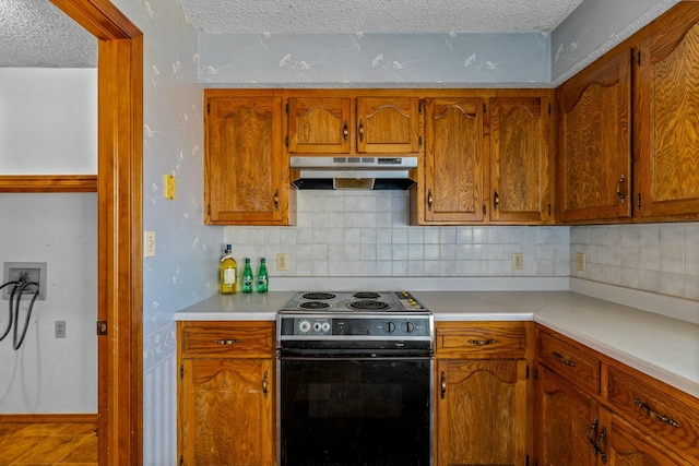 kitchen with backsplash, black electric range, and a textured ceiling