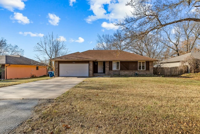 ranch-style home with a garage and a front lawn