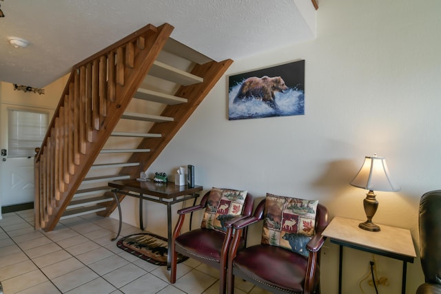 14 Scenic Ct Unit 8, Branson, MO 65616 - staircase featuring tile patterned floors and a textured ceiling
