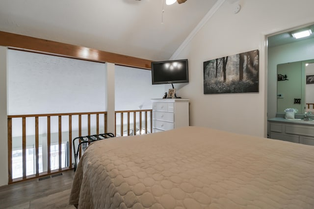 14 Scenic Ct Unit 8, Branson, MO 65616 - bedroom featuring a sink, vaulted ceiling, visible vents, ensuite bathroom, and wood finished floors