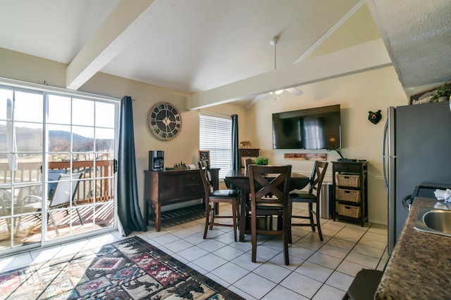 14 Scenic Ct Unit 8, Branson, MO 65616 - dining room featuring vaulted ceiling with beams, a ceiling fan, and light tile patterned floors