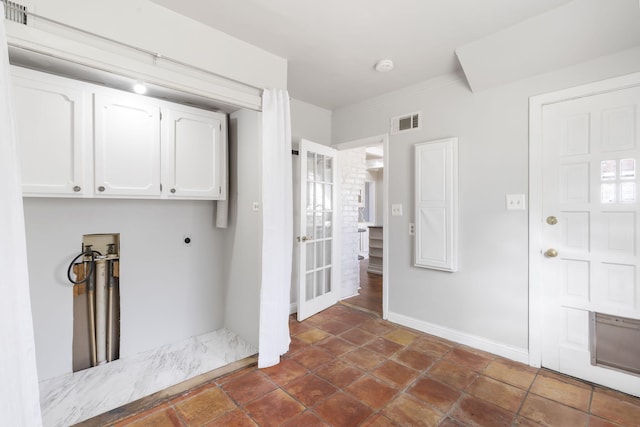 laundry room featuring hookup for a washing machine, cabinets, and hookup for an electric dryer