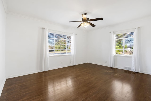 spare room with crown molding, dark hardwood / wood-style flooring, and ceiling fan