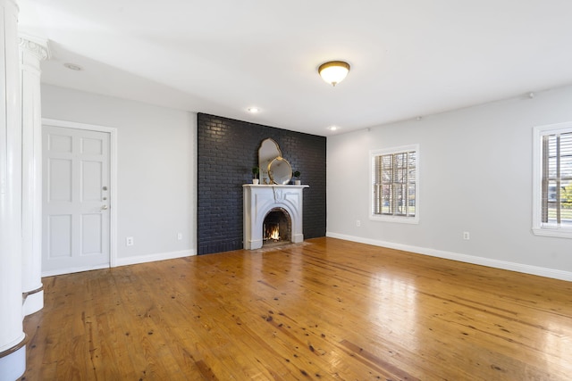 unfurnished living room featuring wood-type flooring