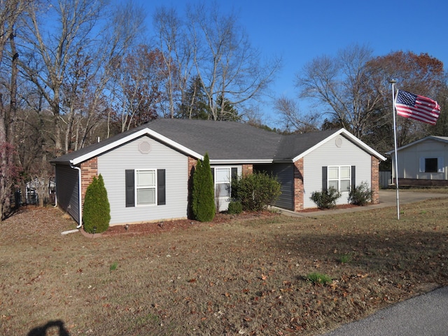 ranch-style house featuring a front lawn