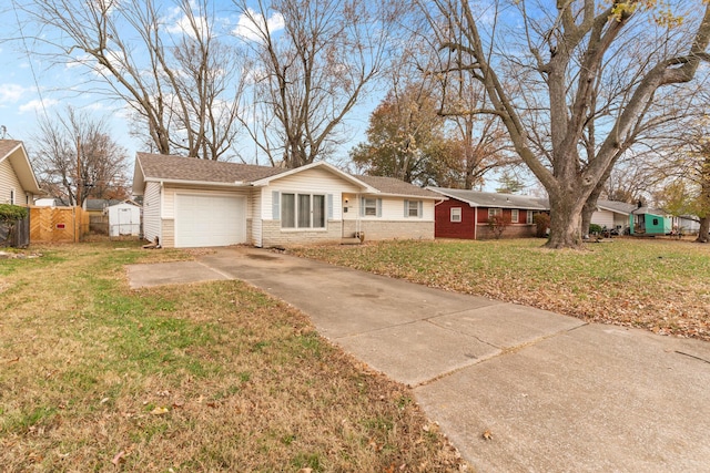 ranch-style home featuring a garage and a front lawn