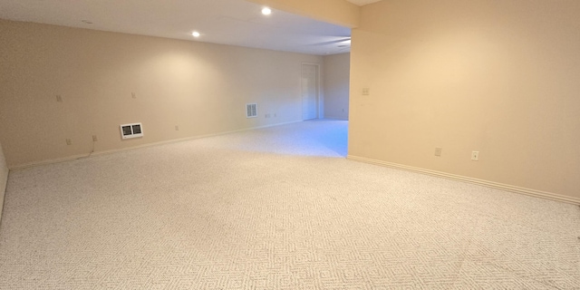 empty room featuring light carpet