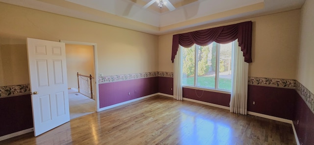 unfurnished room with hardwood / wood-style floors and ceiling fan