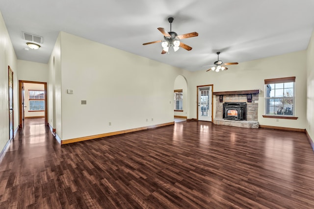 unfurnished living room with dark hardwood / wood-style floors and ceiling fan