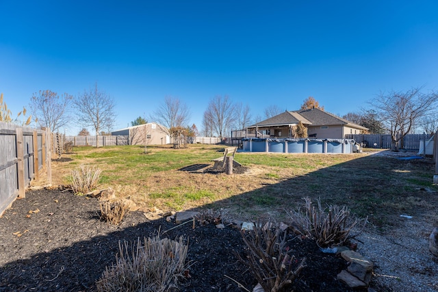 view of yard featuring a covered pool