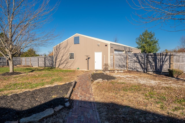 exterior space featuring a lawn and a garage