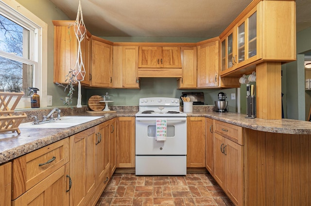 kitchen with electric range and sink