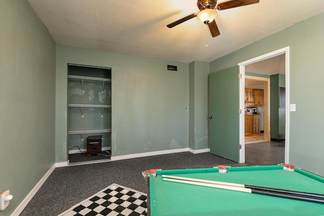 playroom with ceiling fan and dark carpet