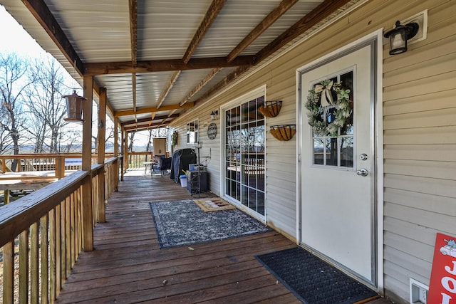 wooden terrace with area for grilling