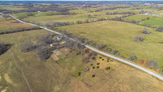 birds eye view of property featuring a rural view