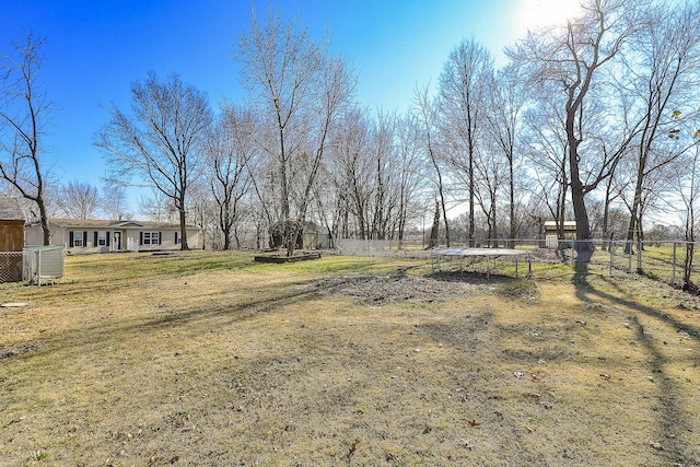 view of yard with a trampoline