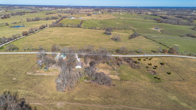 birds eye view of property with a rural view