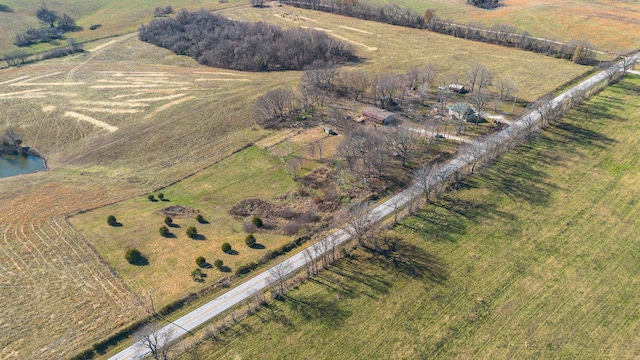 aerial view with a rural view and a water view