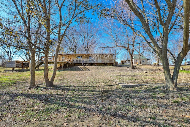 view of yard featuring a wooden deck