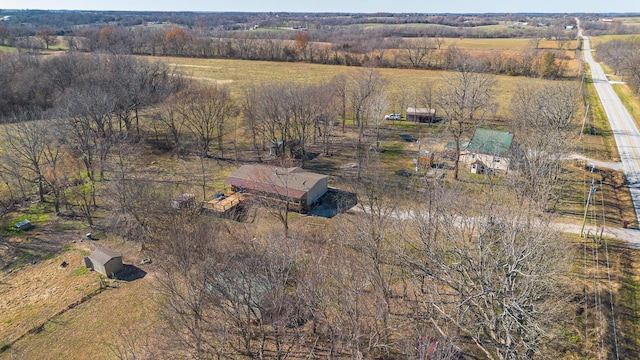 birds eye view of property with a rural view