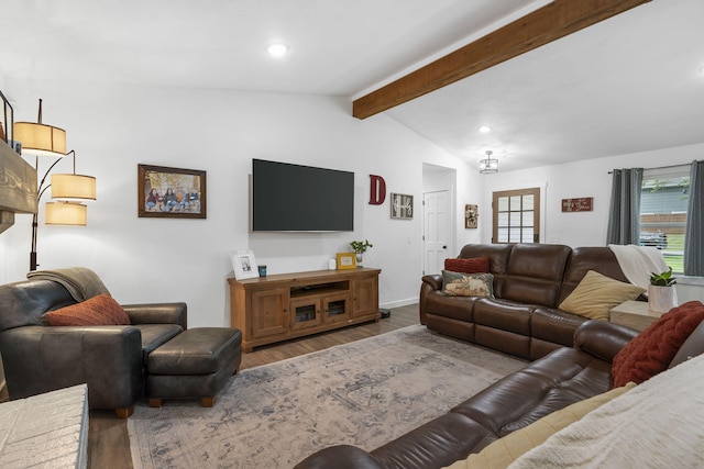 living room featuring vaulted ceiling with beams and wood-type flooring