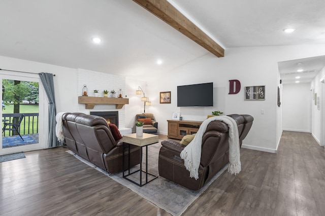 living room featuring vaulted ceiling with beams, a fireplace, and dark wood-type flooring