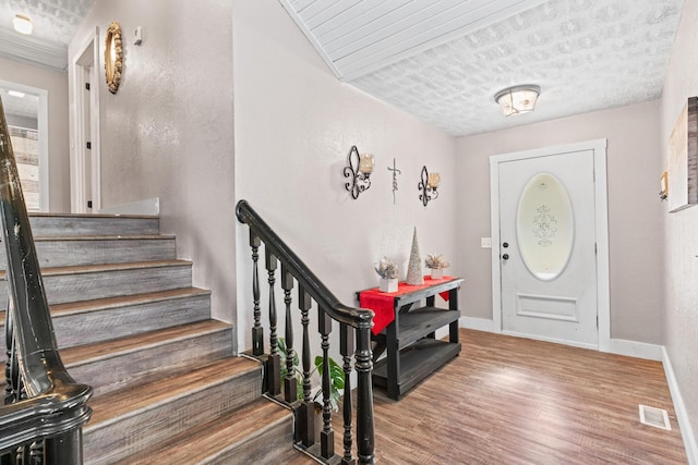 foyer entrance featuring hardwood / wood-style floors