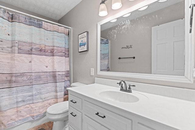 bathroom featuring walk in shower, tile patterned floors, a textured ceiling, toilet, and vanity