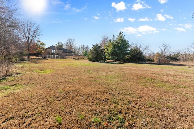 view of yard with a rural view