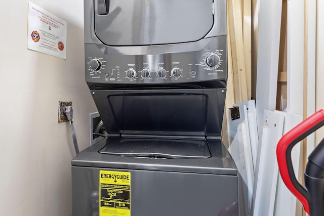 laundry area featuring stacked washing maching and dryer