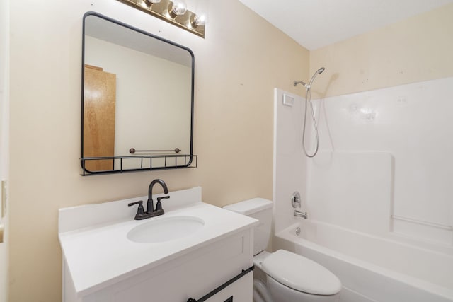 full bathroom featuring bathing tub / shower combination, vanity, and toilet