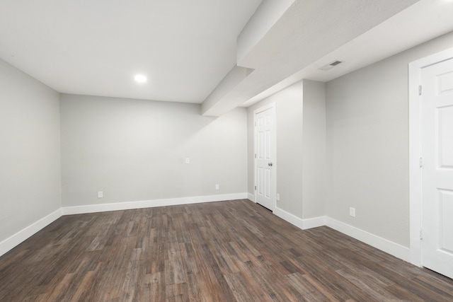 basement featuring dark wood-type flooring