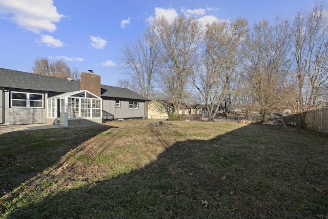 view of yard with a patio area and a sunroom