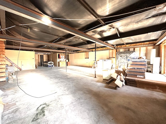 basement featuring washer and clothes dryer