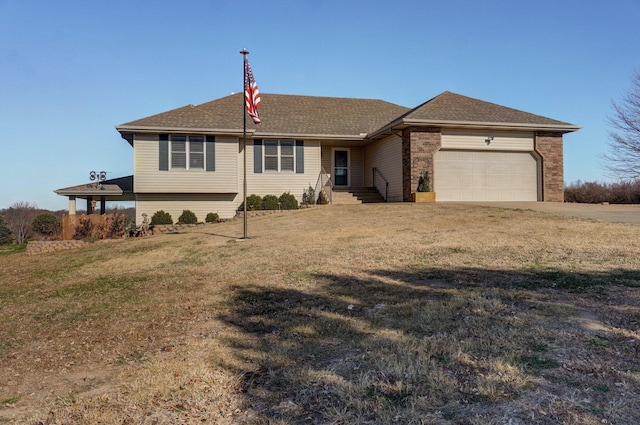 ranch-style house with a garage and a front yard