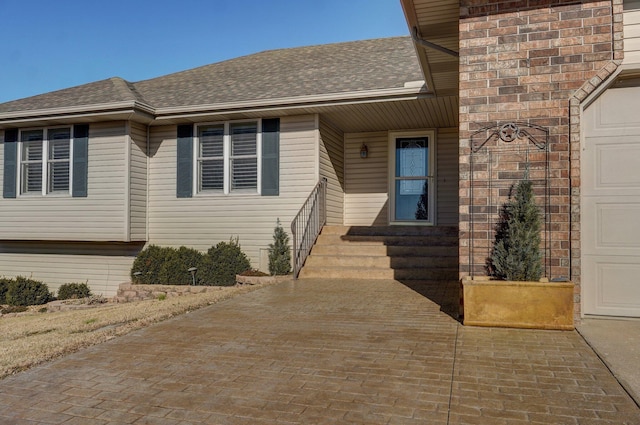 view of exterior entry featuring a garage