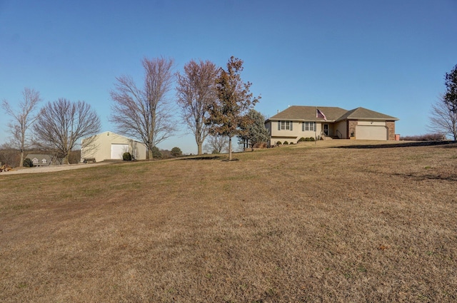 view of yard featuring a garage