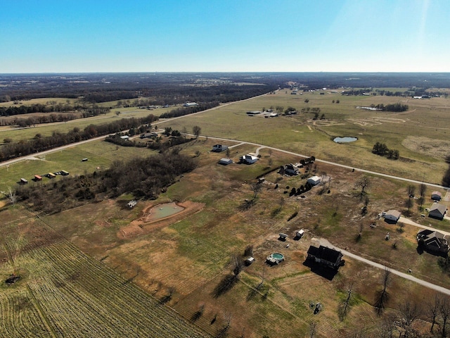 birds eye view of property featuring a rural view