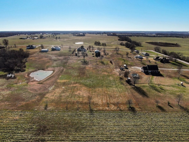 birds eye view of property featuring a rural view