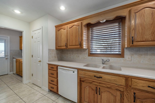 10071 W Farm Road 48, Walnut Grove, MO 65770 - kitchen with dishwasher, light tile patterned floors, light countertops, and brown cabinetry
