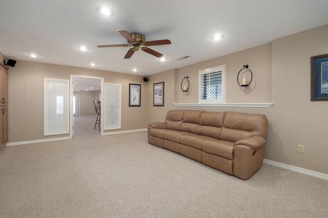 living room featuring ceiling fan and carpet floors